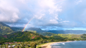 Hanalei Bay beach with rainbow on sunny day